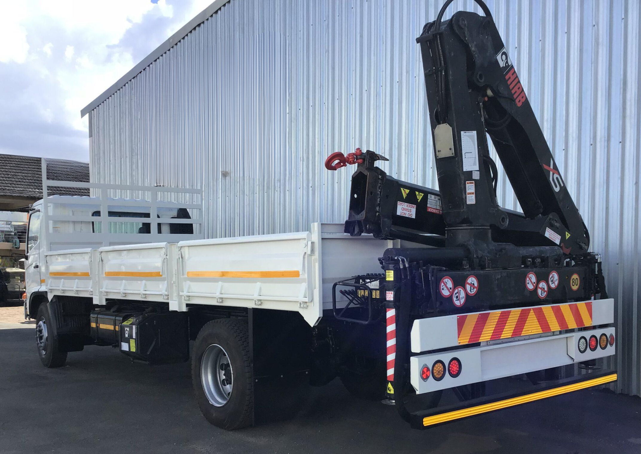 Hino 500 1626 rear mount dropside crane truck.